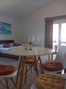 a dining room with a table and two chairs at Vila Nina Donji Štoj in Ulcinj