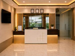 a lobby with a reception desk in a building at Hotel Vrindavan Sultanpur in Sultānpur