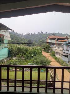a view of a street from a balcony at Coorg homes in Madikeri