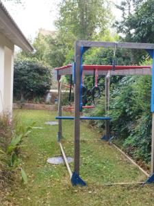 a swing set in a yard at SnirBen zvi in Kibbutz Snir