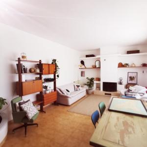 a living room with a table and a couch at Villa Talìa in Marsala
