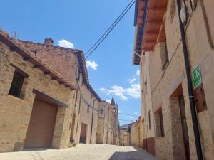an alley in an old town with buildings at Casa Rural Tarayuela in Cantavieja