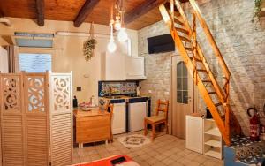 a kitchen with a staircase in a room at La MARUZZELLA in Vietri sul Mare +14 photos