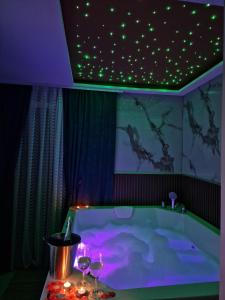 a bathroom with a tub with a star ceiling at Centar Spa Teslic in Teslić +22 photos