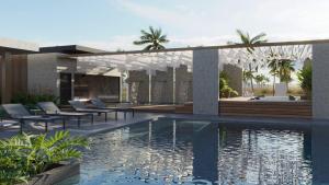 a resort with a swimming pool and lounge chairs at Gav resort beach in Salinópolis