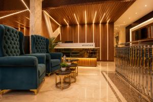a lobby with couches and a table in a building at Hotel Nayyar Regency Near Golden temple in Amritsar