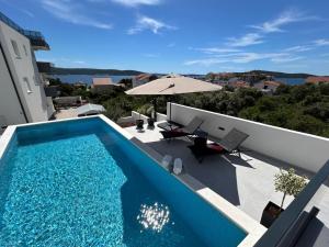 a swimming pool on the roof of a house at Villa Omorfia - SEVID in Sevid
