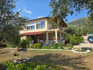 a house on a hill with a yard at Villa Theodora in Himare +36 photos
