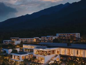 a group of buildings with mountains in the background at The Dali EDITION in Dali