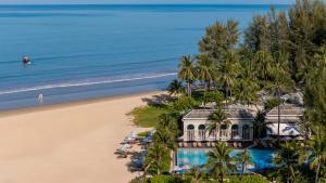 an aerial view of a house on the beach at Devasom Khao Lak Beach Resort & Villas in Khao Lak +43 photos