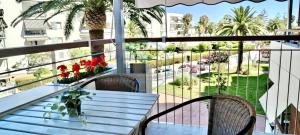 a table and chairs on a balcony with a view at Beach Formentor salou in Salou