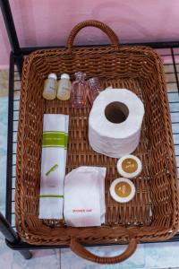 a basket filled with toilet paper and toiletries at PoonsukPlace Sampran in Ban Bang Yai Chuai +20 photos