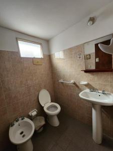 a bathroom with a toilet and a sink at Hotel America in Victoria +31 photos