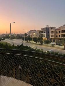 a view from a balcony of a street with buildings at Munir’s residence in Cairo
