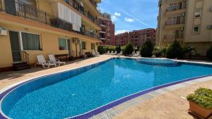 a large swimming pool in the middle of a building at AMADEUS I Studio 25 Sunny Beach in Sunny Beach