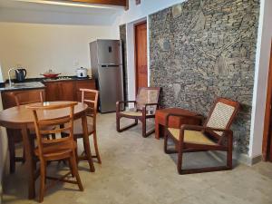 a kitchen with a table and chairs and a refrigerator at 2 Bed Apartment in Colombo 3 in Colombo
