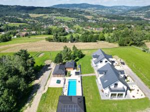 an aerial view of a home with a swimming pool and a house at Lipove Spa in Lipowe