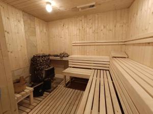 an empty sauna with two benches in it at Lipove Spa in Lipowe