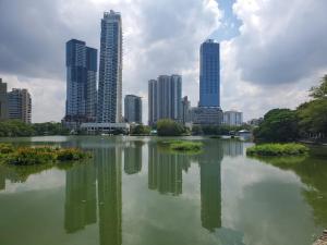 a lake in front of a city with tall buildings at 2 Bed Apartment in Colombo 3 in Colombo