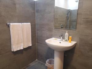 a bathroom with a sink and a mirror at 2 Bed Apartment in Colombo 3 in Colombo +19 photos