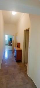 an empty room with a desk and a hallway at Gasthaus Kopper in Guttaring +12 photos