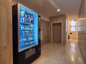 a vending machine in a hallway with a drink cooler at Old Town 63 in Paphos