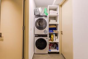 a laundry room with a washer and dryer at Old Town 63 in Paphos +115 photos