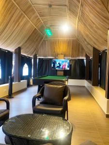 a room with a ping pong table and a pool table at Heritage Apartment in Ibadan
