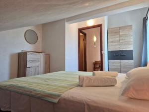a bedroom with a large bed in a room at Apartments Tea Pag in Pag +133 photos
