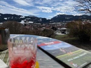 a glass sitting on top of a table with a view at "Unter Freunden", Design Meets Allgäu in Wertach