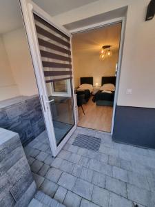 a room with a door leading to a bedroom at Biały Port in Rajgród +121 photos