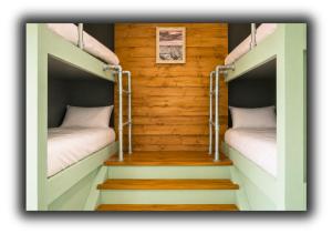 two bunk beds in a room with stairs at Pitchside Rooms in Liverpool +56 photos