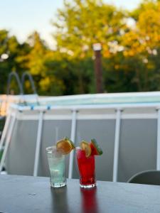two cocktails sitting on top of a table at Vikendica Peace in Brezje