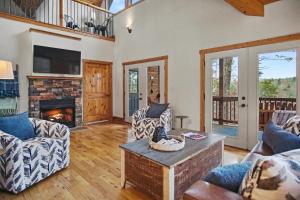 a living room with a couch and a fireplace at Mountain Views, Game Room, Firepit Near Wineries in Cleveland
