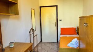 a room with a bedroom with a bed and a door at Tuscan Charm Spacious Florence Home in Campi Bisenzio +18 photos