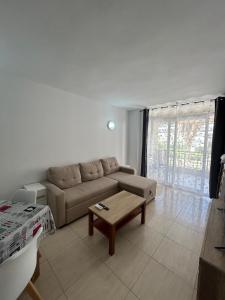 a living room with a couch and a coffee table at Cozy Apartment with Pool at 5 Min to Beach in Salou