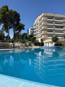 a large swimming pool in front of a building at Cozy Apartment with Pool at 5 Min to Beach in Salou