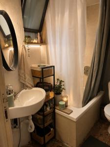 a bathroom with a sink and a shower and a toilet at Narkis - A Boutique Stay in the Heart of Jerusalem in Jerusalem +47 photos