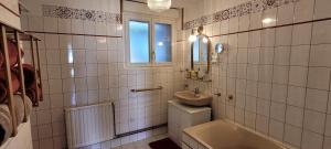 a bathroom with a sink and a toilet and a tub at Le Clos des chênes rouges in Corrobert +28 photos