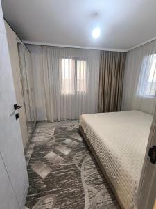 a bedroom with a bed in a room at Ashtarak home in Ashtarak