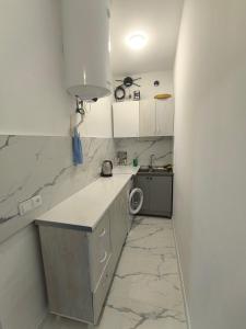 a small kitchen with a counter and a sink at Ashtarak home in Ashtarak