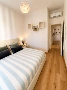 a bedroom with a large bed in a room at Piazza Sant'Alfonso Apartment in Francavilla al Mare