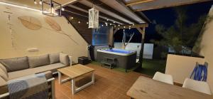 a living room with a couch and a tv at Bella Vista 234 in Lajita