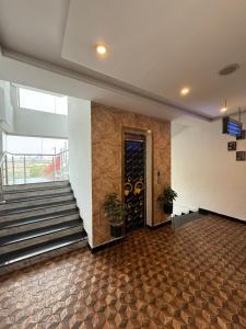 a room with a staircase and a door to a building at Grand Mongolia in Rawalpindi
