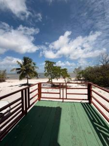 a wooden deck with a view of the beach at casa sol in Bragança