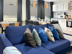 a blue couch with pillows on top of it at Gruppenloft Stuttgart Kicker & 14 Gäste in Stuttgart