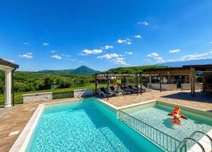 a swimming pool with a view of the mountains at Villa Leah in Bihać