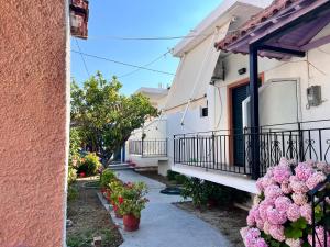 a row of houses with flowers on the balconies at Villa Xenia in Ammoudia