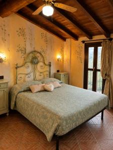 a bedroom with a large bed in a room at La Rocca Sospesa in Apricale