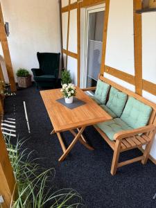 a room with a couch and a table and a chair at Ferienwohnung Anna in Heimbach